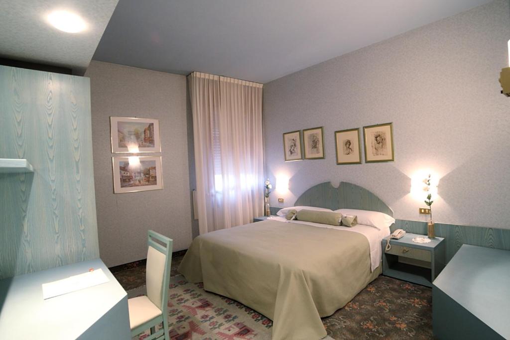 Postel nebo postele na pokoji v ubytování Hotel Globo