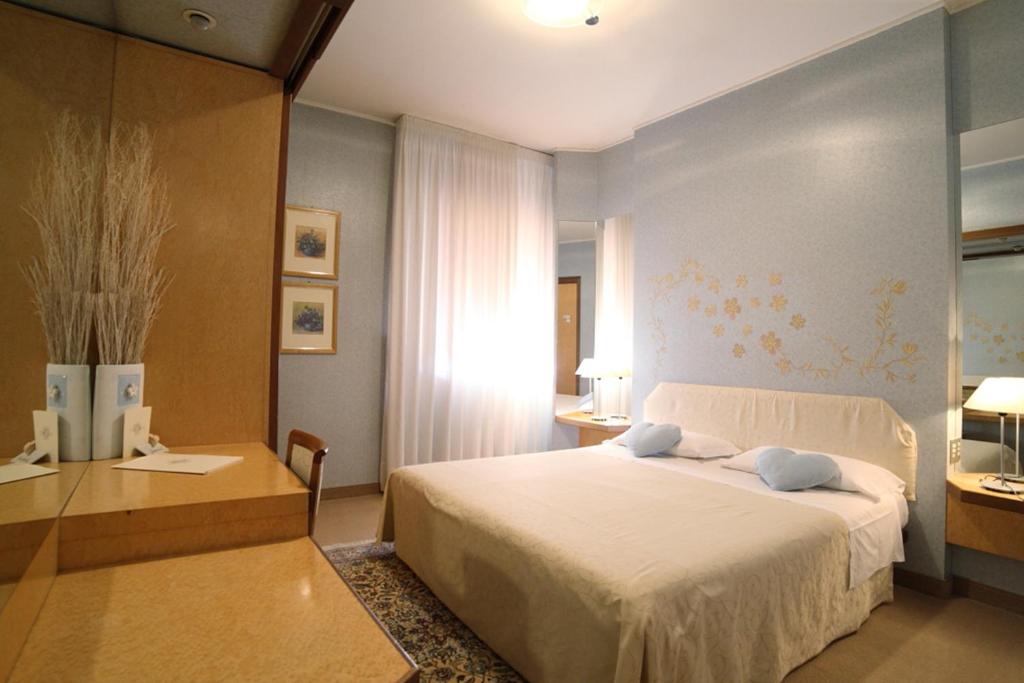 Postel nebo postele na pokoji v ubytování Hotel Globo