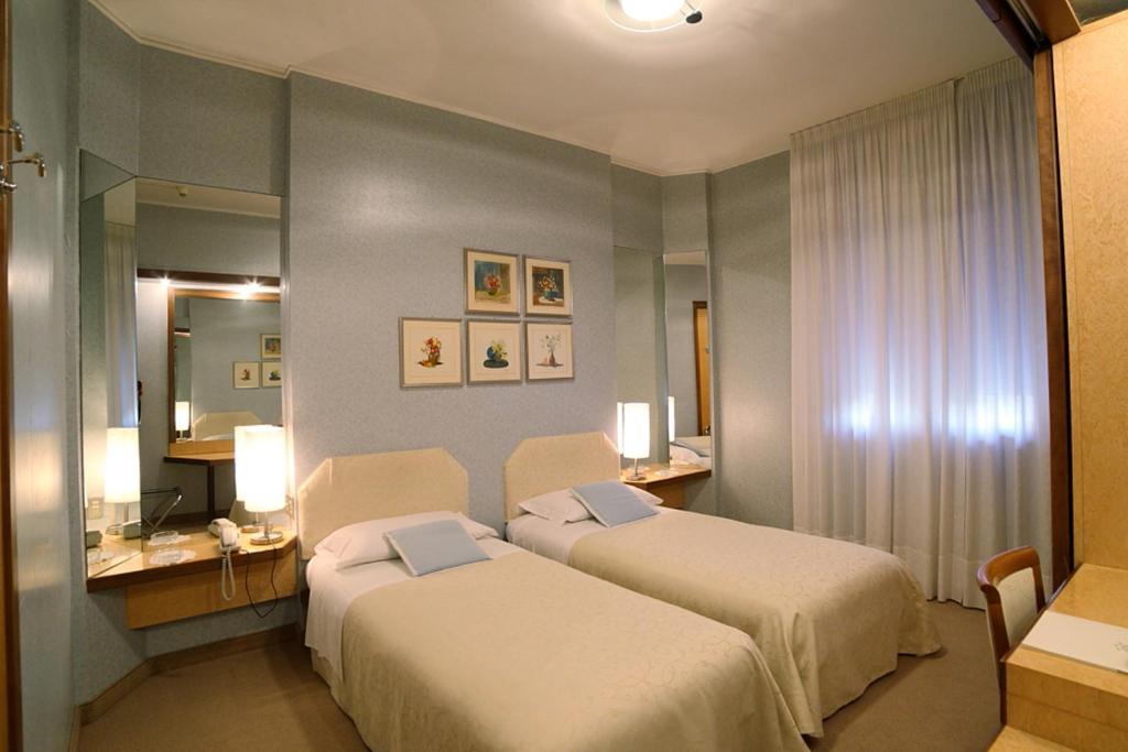 Postel nebo postele na pokoji v ubytování Hotel Globo