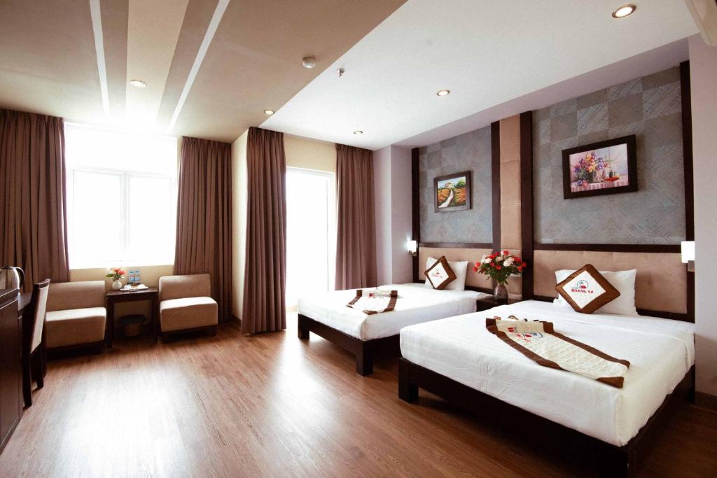 Postel nebo postele na pokoji v ubytování Hoang Sa Hotel