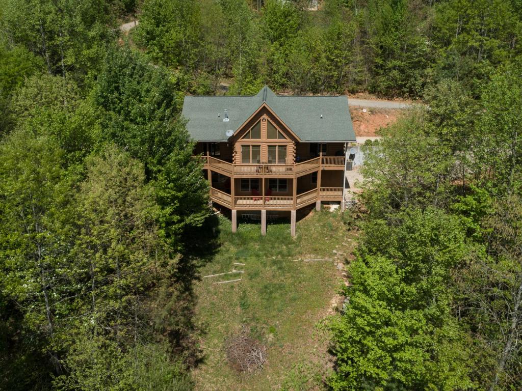 an overhead view of a large house in the woods at stayNantahala - Smoky Mountain Cabins in Aquone