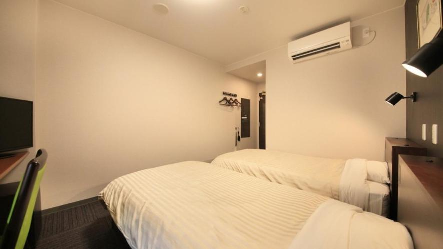 Postel nebo postele na pokoji v ubytování Hotel Coonel Inn