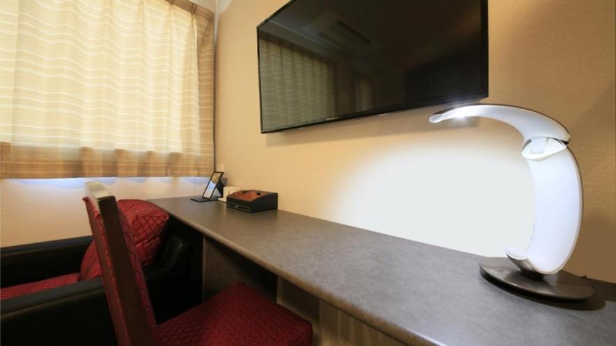 TV a/nebo společenská místnost v ubytování Hotel Coonel Inn