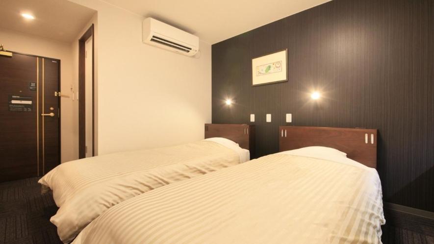 Postel nebo postele na pokoji v ubytování Hotel Coonel Inn