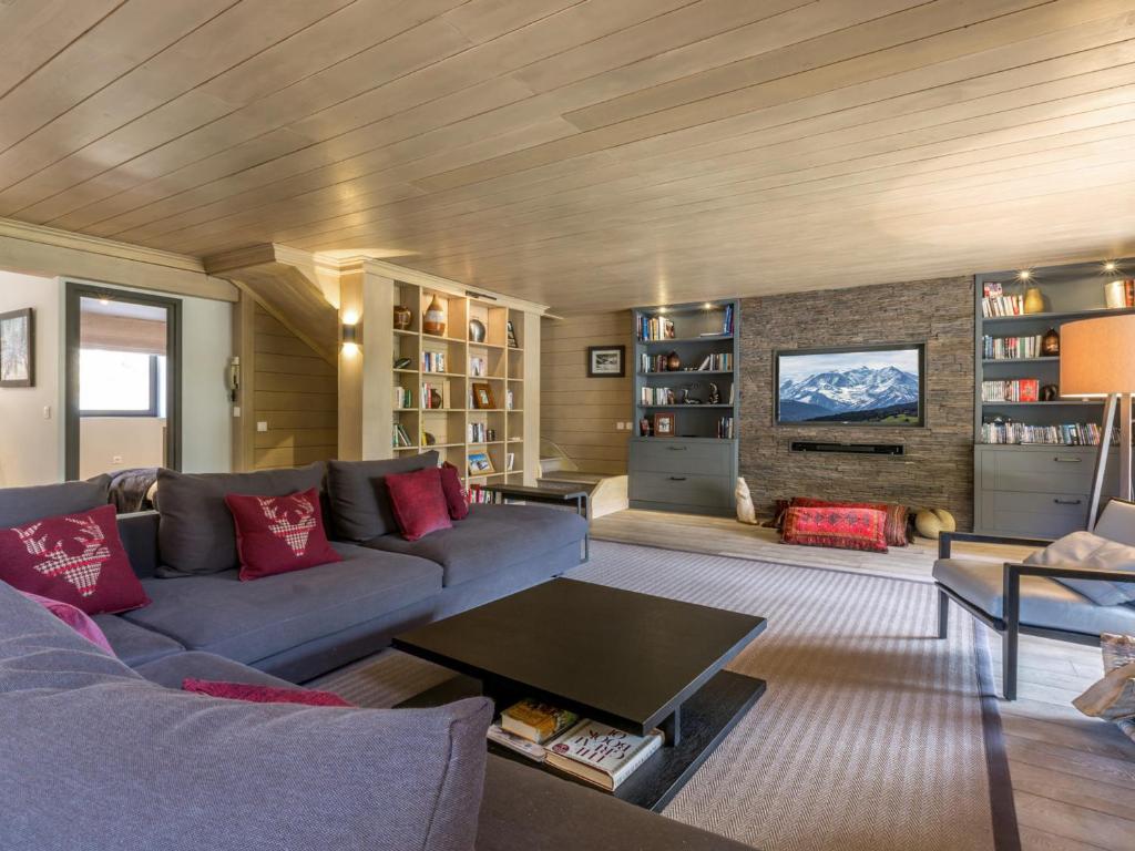 a living room with a couch and a fireplace at Appartement Val-d'Isère, 5 pièces, 8 personnes - FR-1-694-96 in Val-d'Isère
