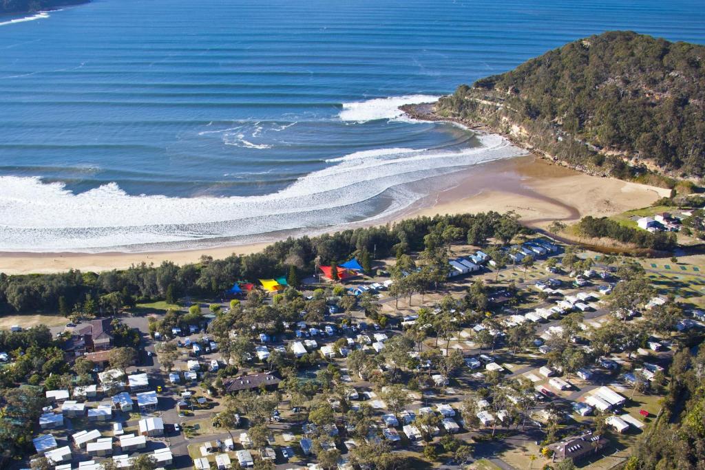 a beach with a large body of water at NRMA Ocean Beach Holiday Resort in Umina