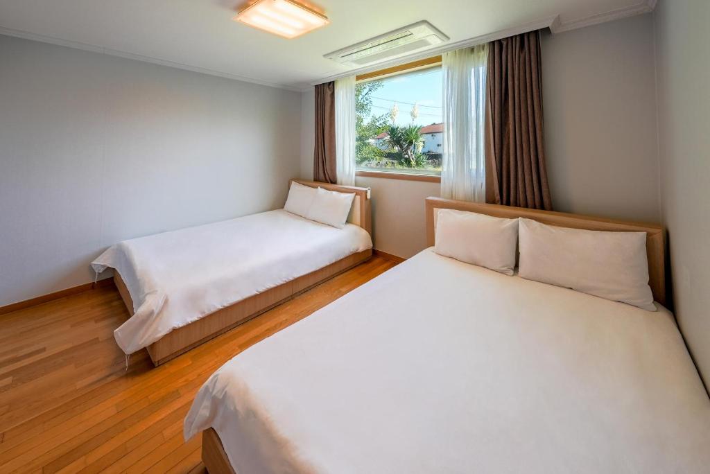 Postel nebo postele na pokoji v ubytování Harmony Resort