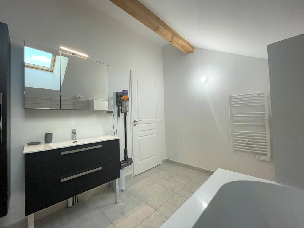 a bathroom with a sink and a bath tub at Chalet Puy-Saint-Pierre, 4 pièces, 8 personnes - FR-1-330C-136 in Puy-Saint-Pierre