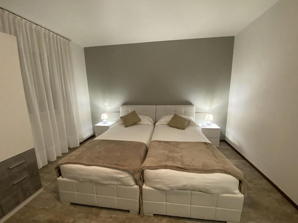 Postel nebo postele na pokoji v ubytování Albergo Stazione
