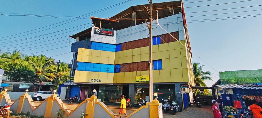 a building under construction on a city street at STAYMAKER Hotel Keerthi in Māvalli