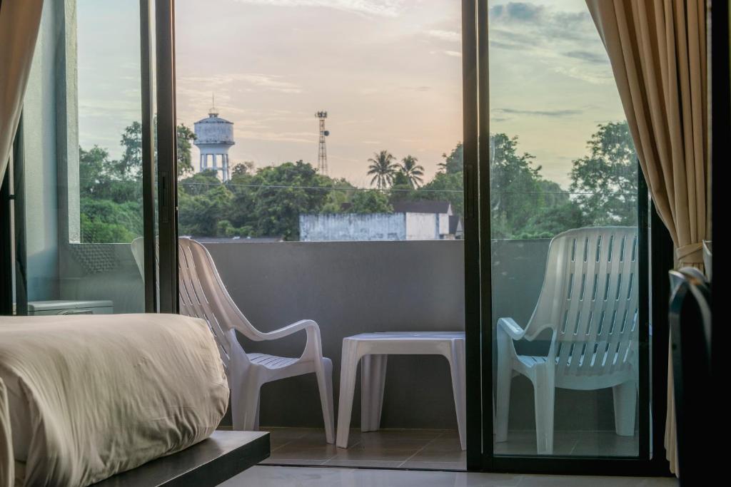 Cama ou camas em um quarto em Sleep Whale Hotel