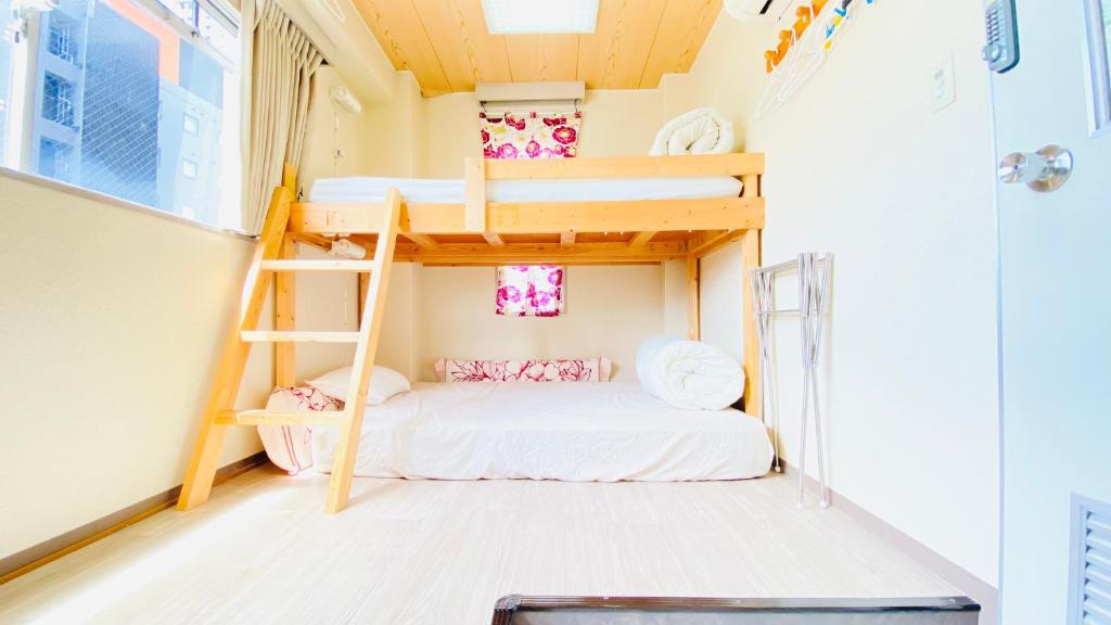 Postel nebo postele na pokoji v ubytování GUEST HOUSE B's FiveⅡ