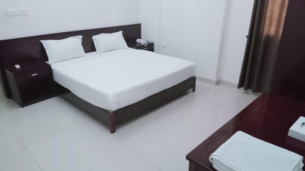 Postel nebo postele na pokoji v ubytování Al Basateen Hotel Rumays