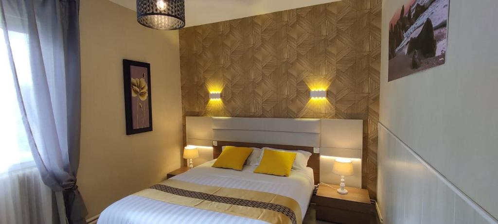 Letto o letti in una camera di Hotel Belle Vue