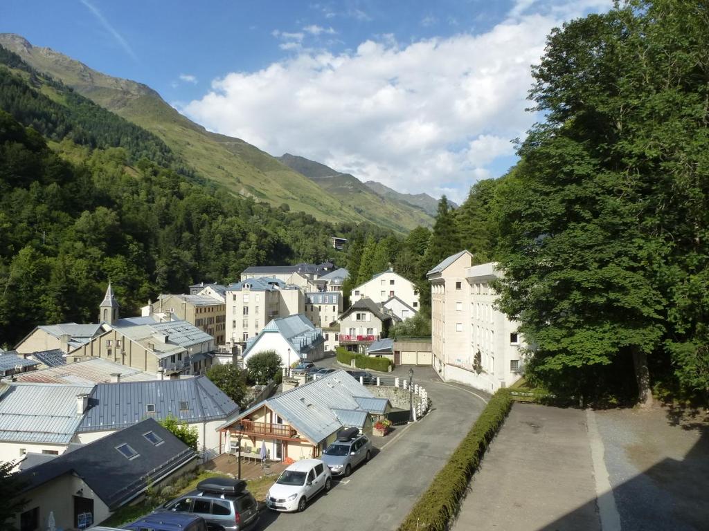 a small town in the mountains with cars parked at Boost Your Immo Néouvielle Barèges PM19 in Barèges