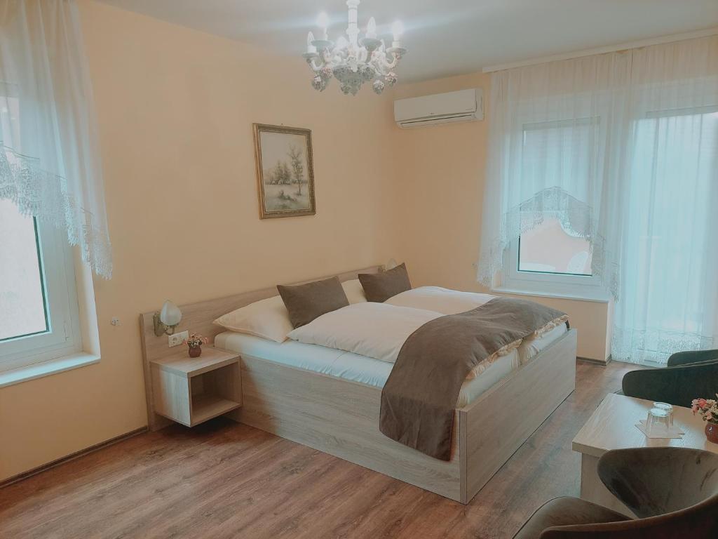 Postel nebo postele na pokoji v ubytování Hotel Panorama