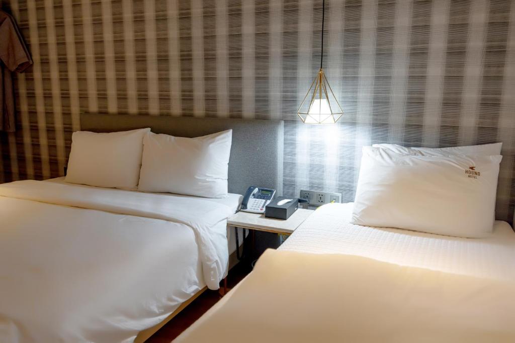 Postel nebo postele na pokoji v ubytování Hound Hotel Seomyeon-Beomcheon