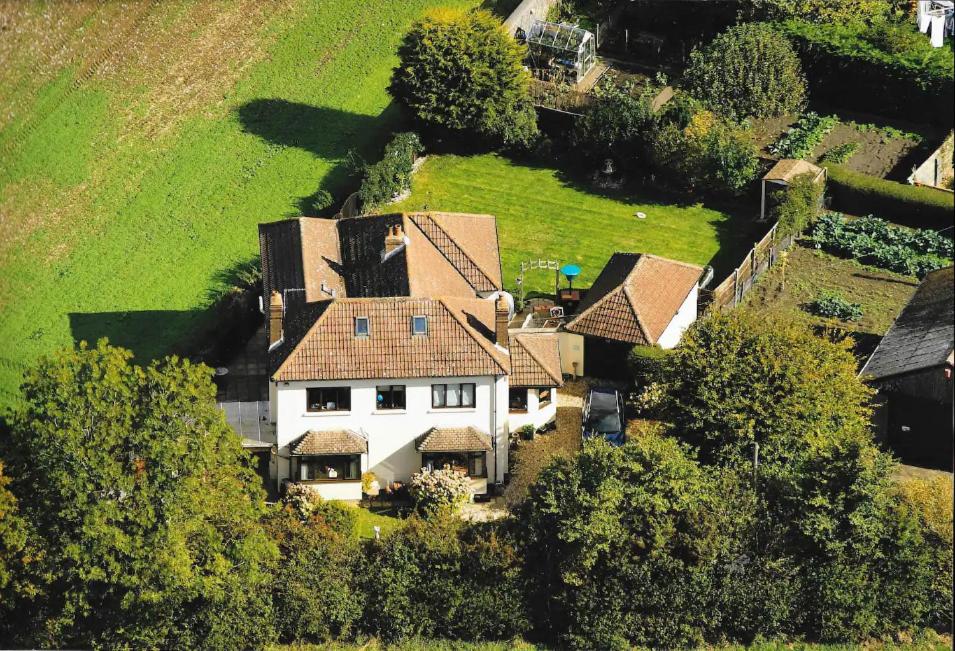 an aerial view of a large white house at Willow Ridge - a large country house with a king and Single or Twin room in Clutton