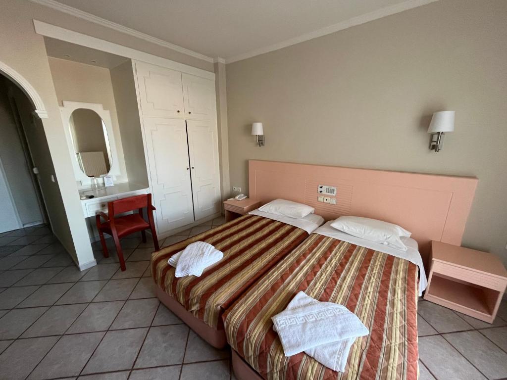 Postel nebo postele na pokoji v ubytování Philoxenia
