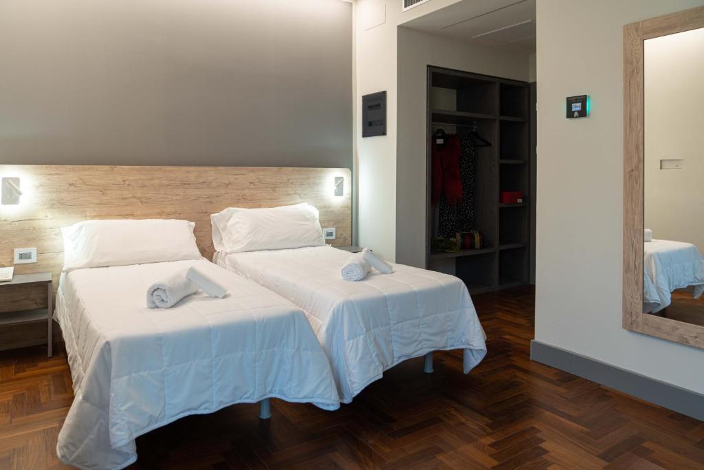Postel nebo postele na pokoji v ubytování Hotel Ambrosiano