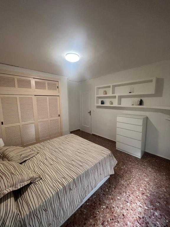 מיטה או מיטות בחדר ב-Casa Conxin Beach & Mountain Apartment Costa Blanca