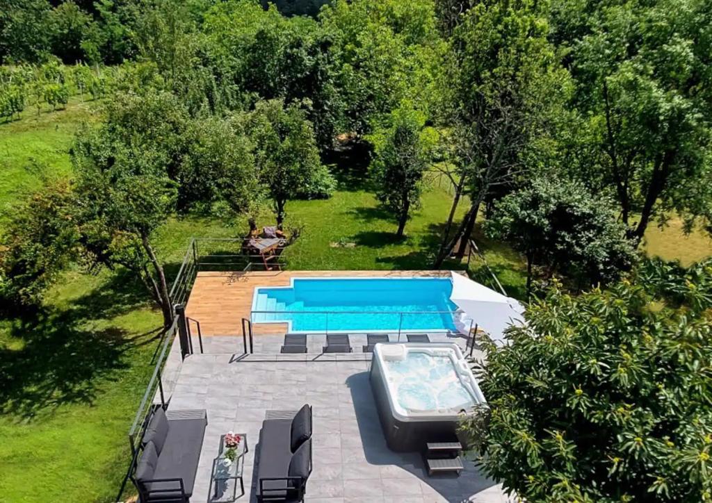 an overhead view of a swimming pool in a yard at House with hot tub, sauna and swimming pool near Zagreb in Gudci