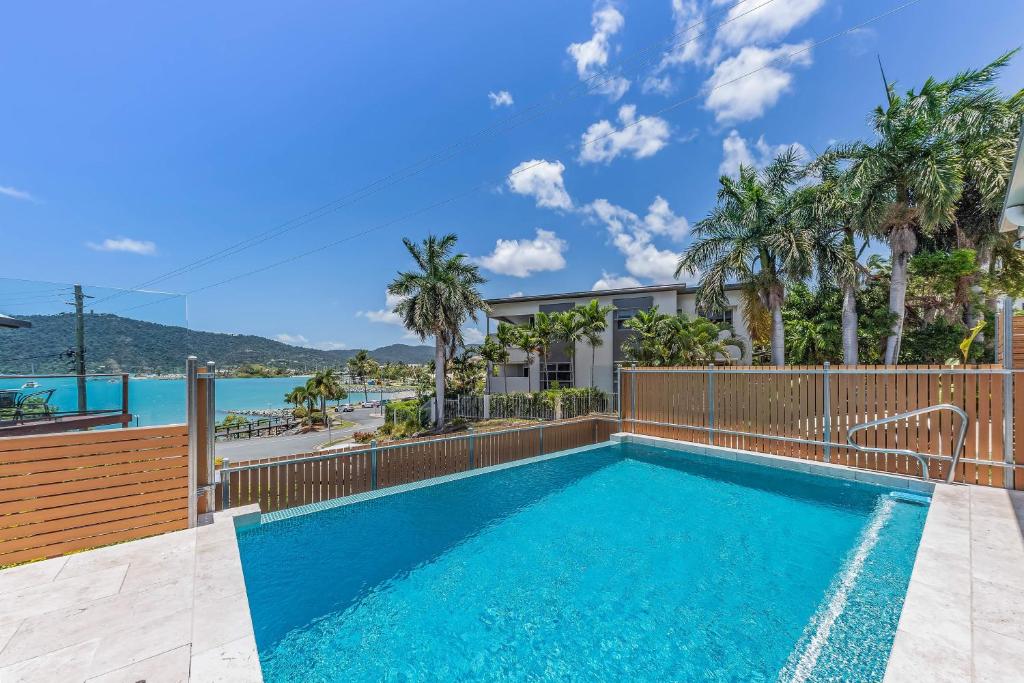 an image of a swimming pool in a house at Whitsunday living on Hillcrest in Airlie Beach