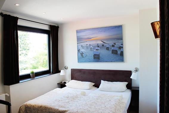 Postel nebo postele na pokoji v ubytování Hotel Seemöwe