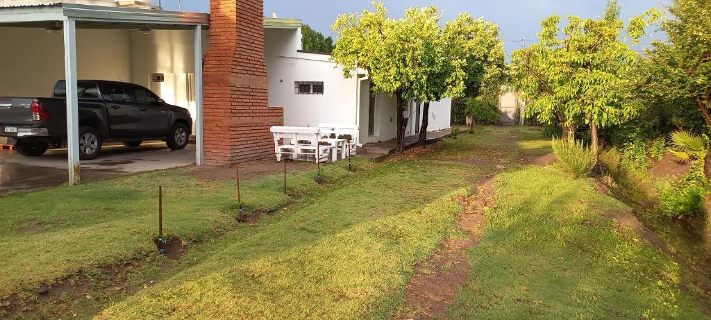 a driveway to a house with a truck parked next to it at Nuestro Sueño in San Rafael
