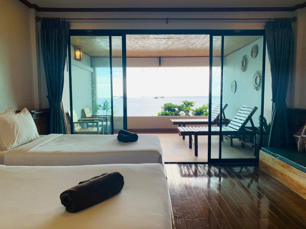 Postel nebo postele na pokoji v ubytování Koh Tao Heritage