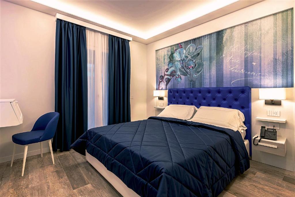 Postel nebo postele na pokoji v ubytování Petit Hotel