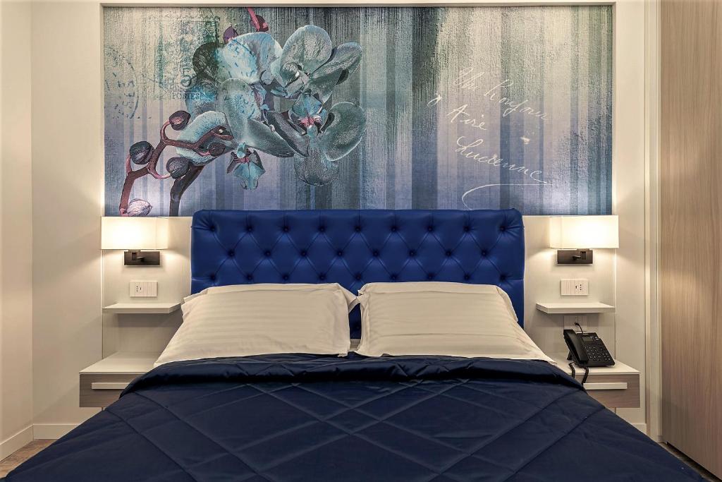 Postel nebo postele na pokoji v ubytování Petit Hotel