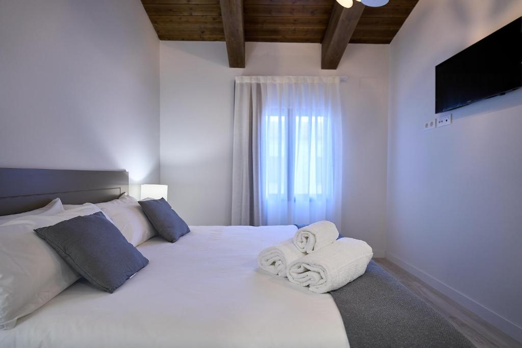 Postel nebo postele na pokoji v ubytování Inés Luna Suites