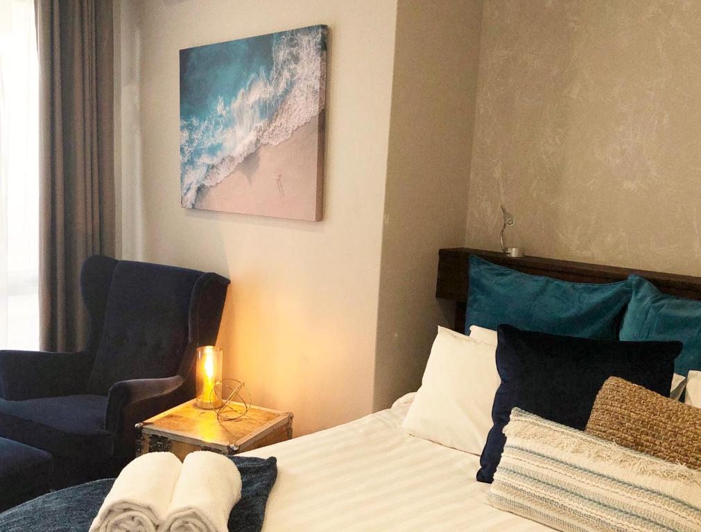 Postel nebo postele na pokoji v ubytování Fremantle Boutique Accommodation - Maand Up