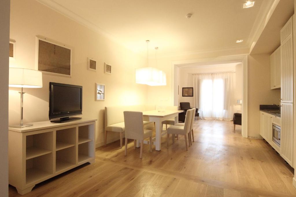 Televízia a/alebo spoločenská miestnosť v ubytovaní Relais Villa Il Palagio