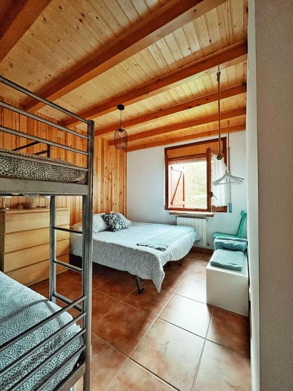 A bed or beds in a room at Apartaments Cel i Fusta