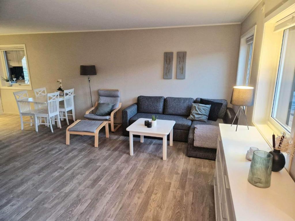 a living room with a couch and a table at Apartment in Kabelvåg in Kabelvåg