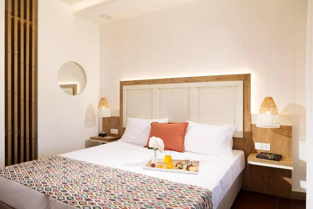 Postel nebo postele na pokoji v ubytování Kalypso Hotel