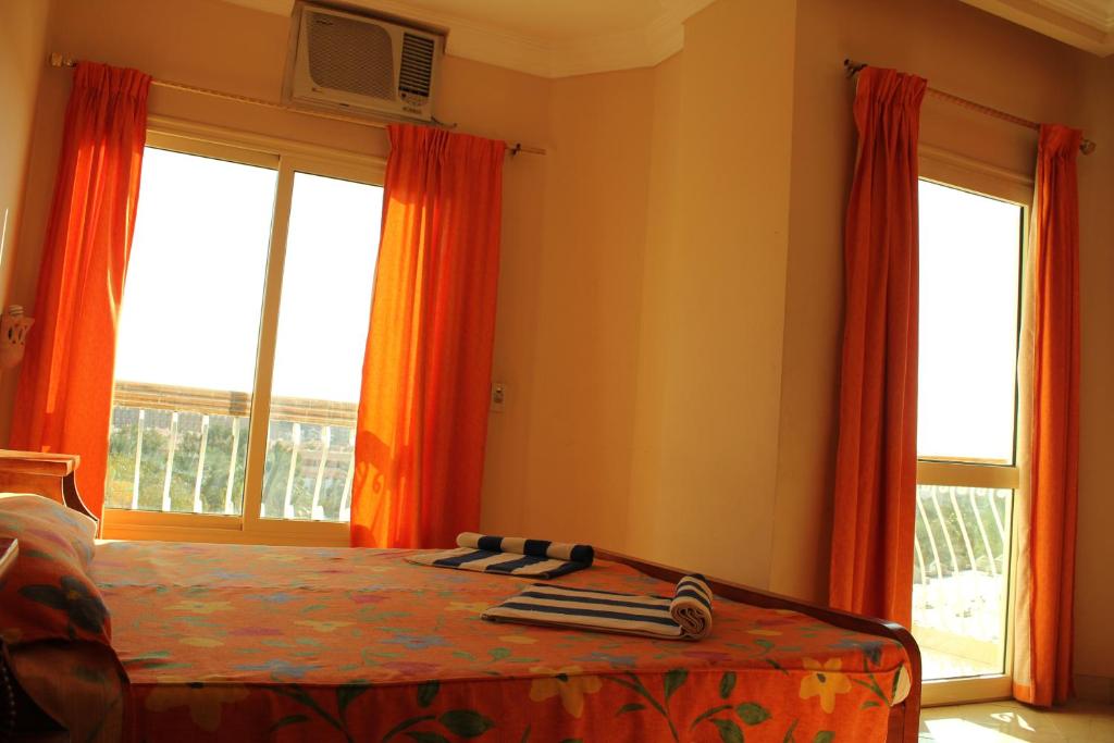 Postel nebo postele na pokoji v ubytování Golden Rose Hotel