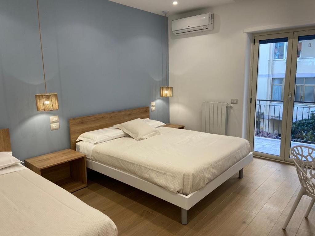 Postel nebo postele na pokoji v ubytování B&B MoMi Sorrento