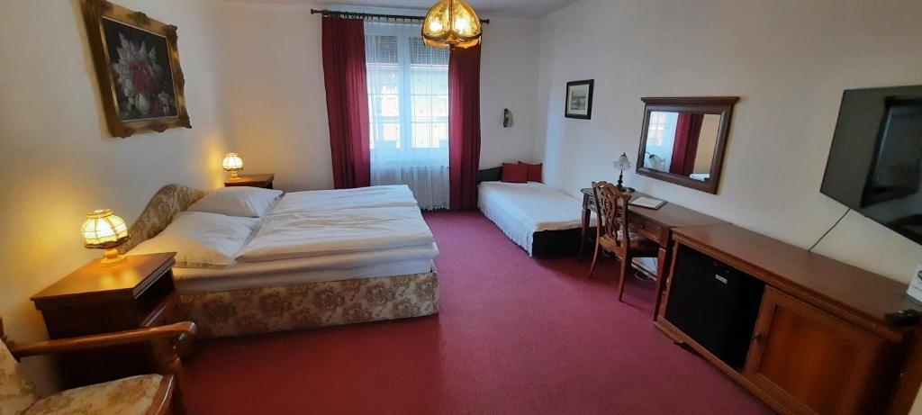 Postel nebo postele na pokoji v ubytování Hotel Excellent