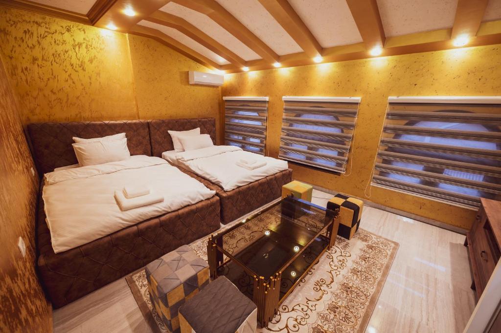 Postel nebo postele na pokoji v ubytování Hotel Premium