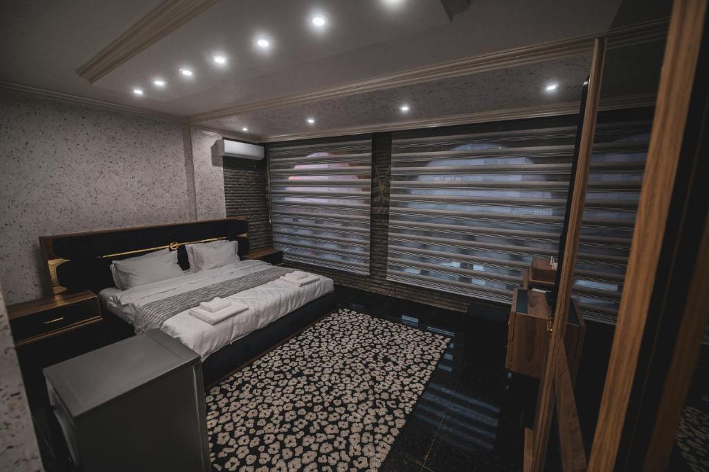 Postel nebo postele na pokoji v ubytování Hotel Premium