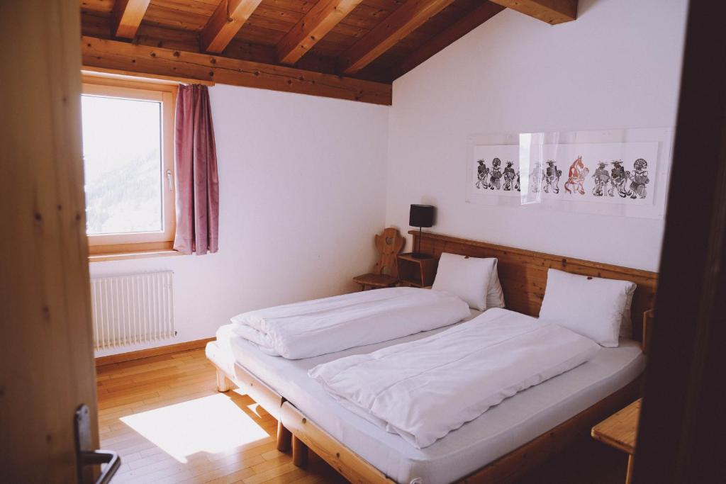 Postel nebo postele na pokoji v ubytování Berghaus Sulzfluh