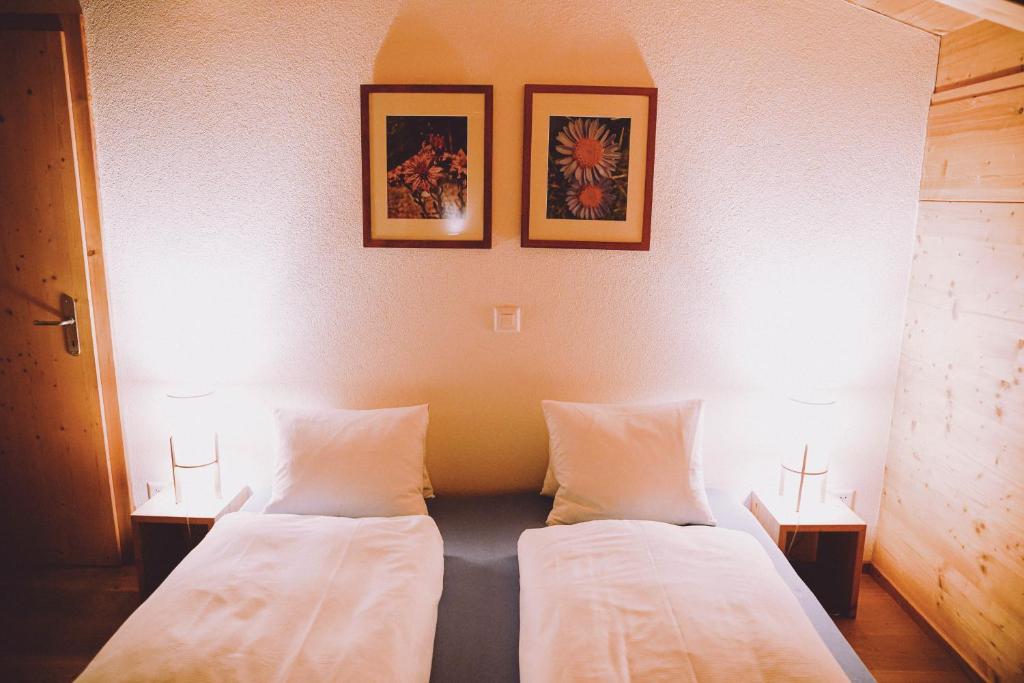 Postel nebo postele na pokoji v ubytování Berghaus Sulzfluh