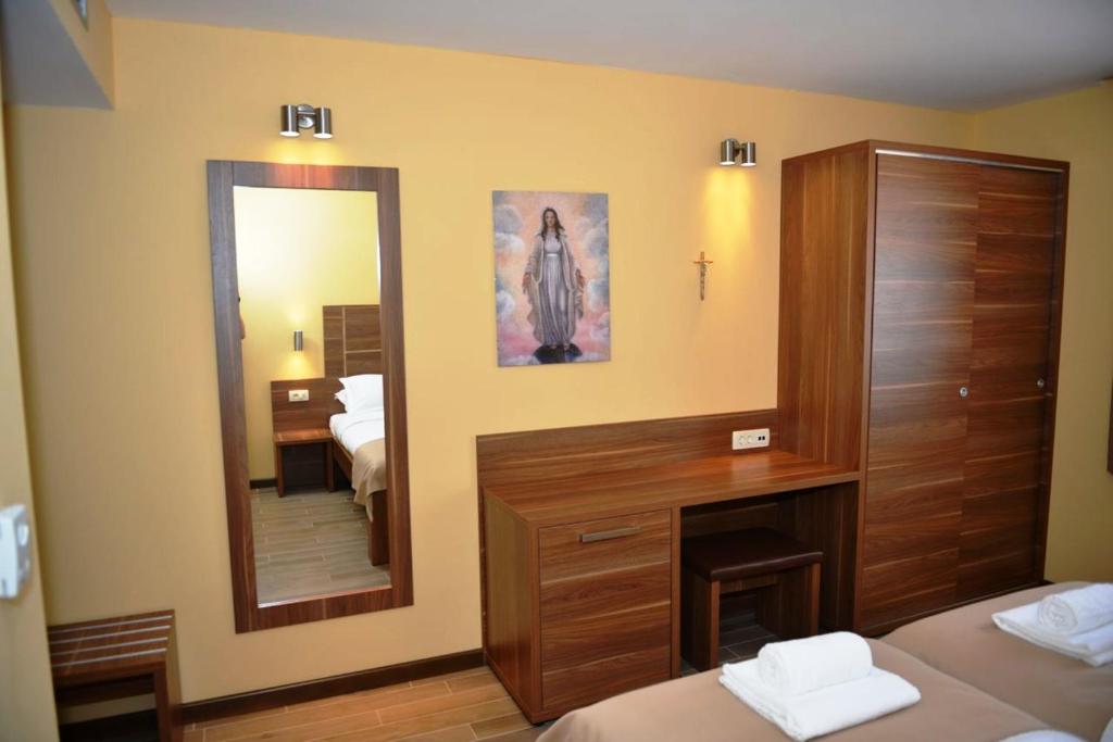 Postel nebo postele na pokoji v ubytování Hotel Pax Cordis