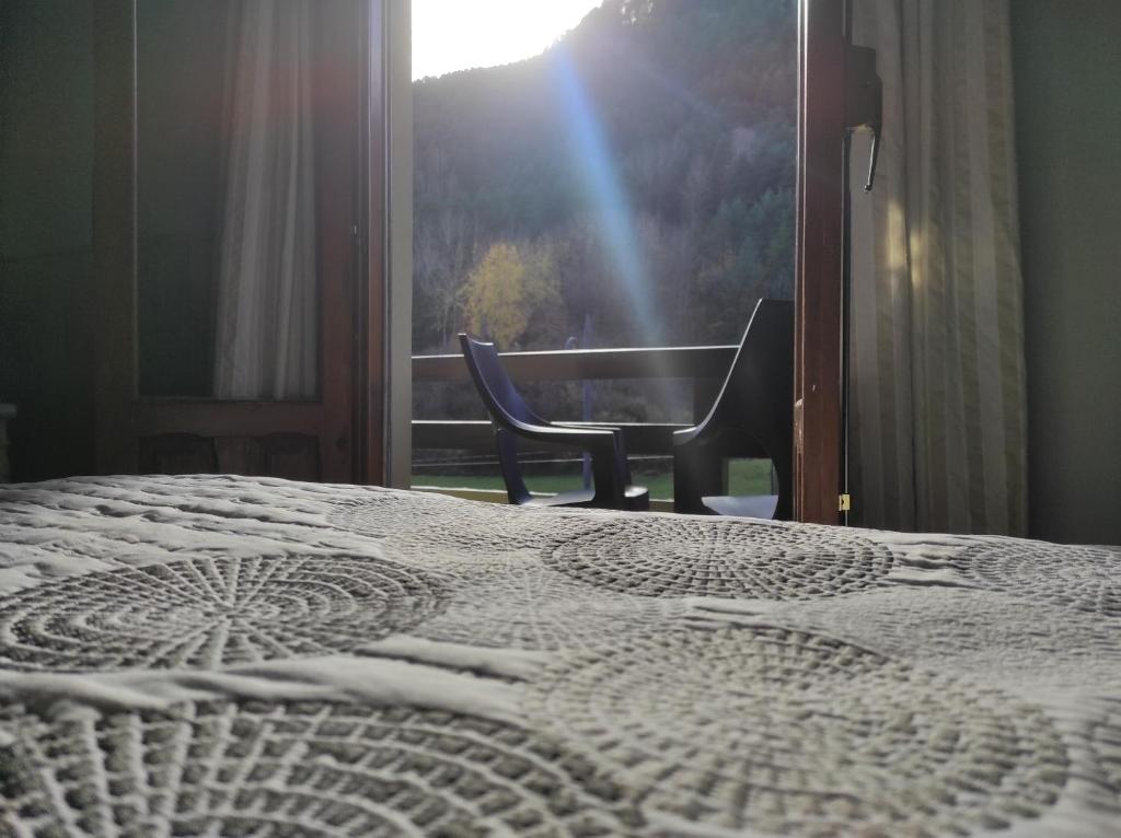 Postel nebo postele na pokoji v ubytování Snö Hotel Bielsa