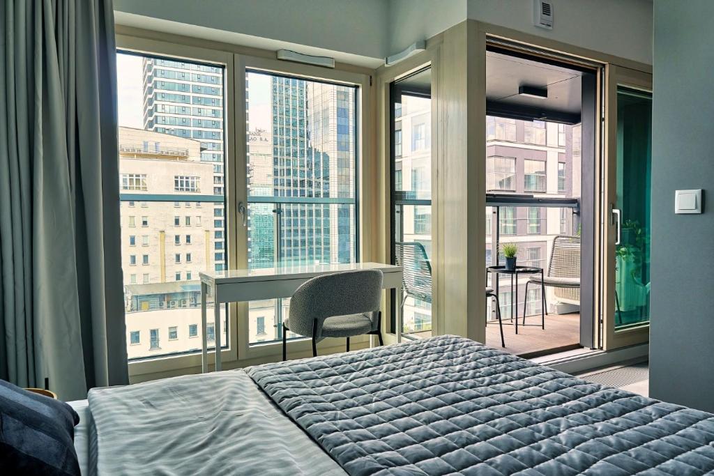 Posteľ alebo postele v izbe v ubytovaní Mennica Residence Deluxe