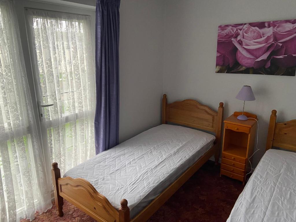 Ένα ή περισσότερα κρεβάτια σε δωμάτιο στο 3 Bedroom House With Balcony Close To Beach