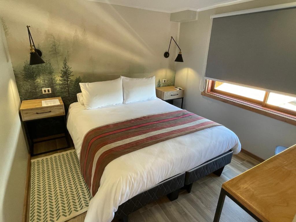 Postel nebo postele na pokoji v ubytování Mawün Hotel Pucón